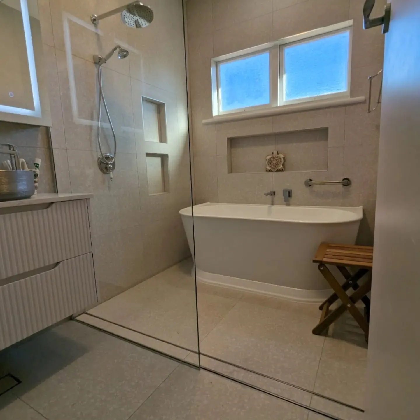 Belmont North bathroom renovation by Sunshower: terrazzo-look tiles, walk-in shower and freestanding bath